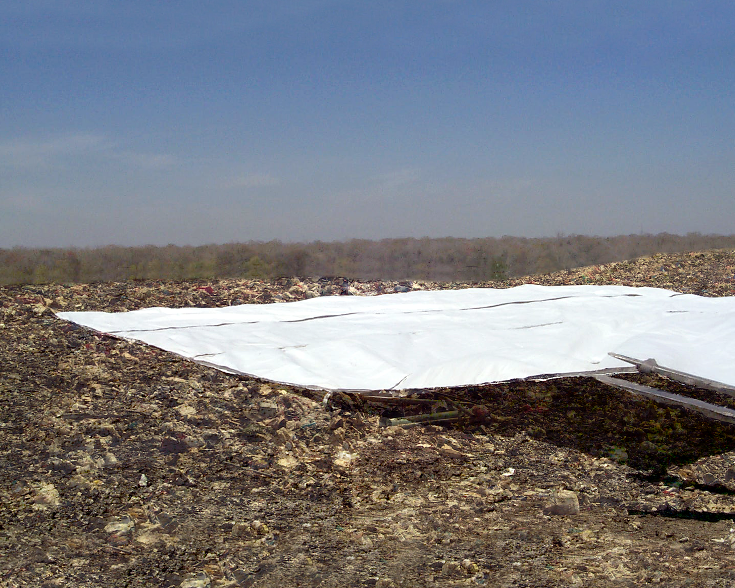 [I] LandPac- Small LandPac Being Pulled Across Field